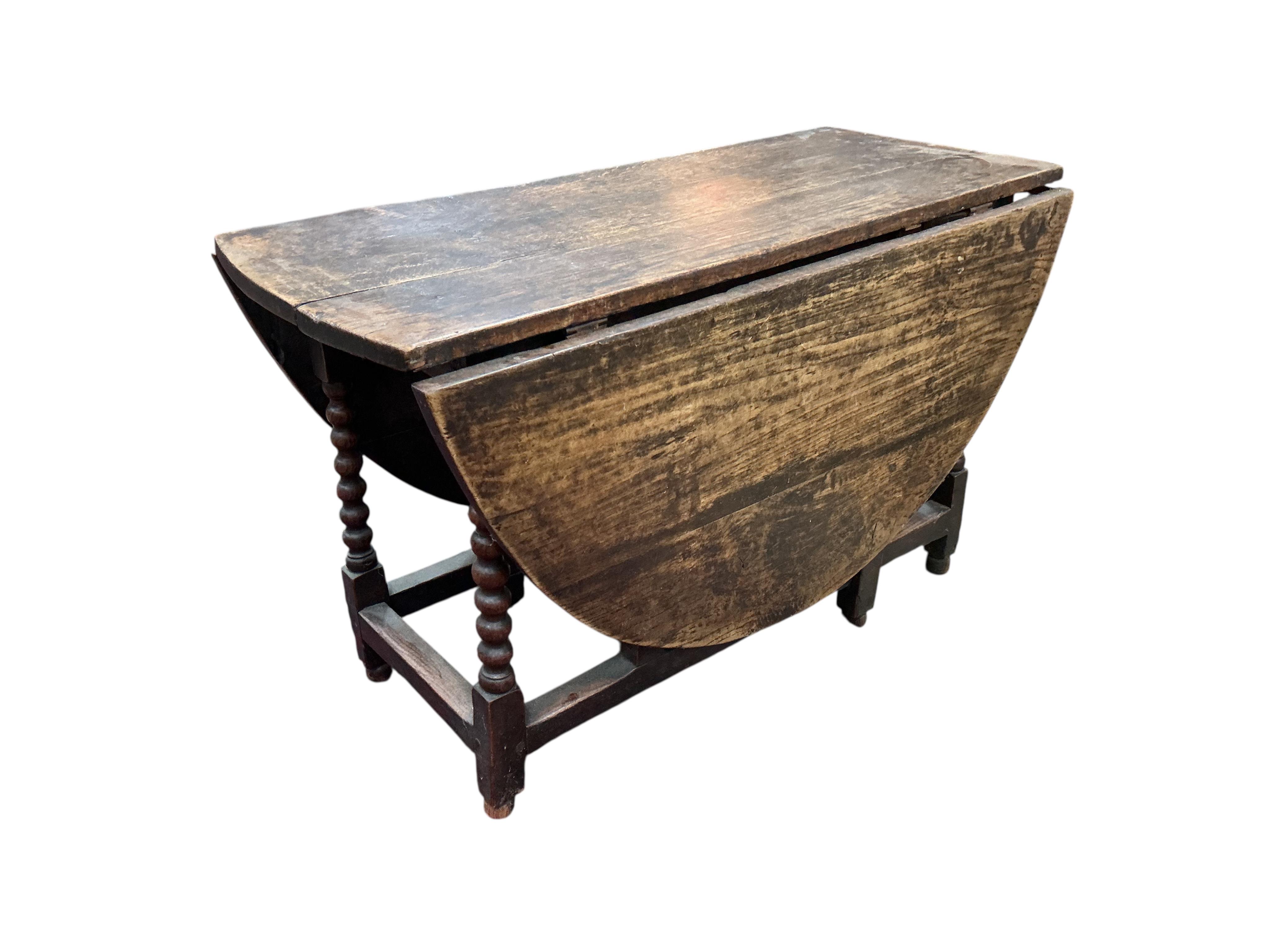 An oak gate leg table, width 120cm, depth 53cm, height 74cm